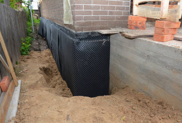 SJ Waterproofing Pros technician performing targeted Sump Pump Installation assessment in Ravenna, OH